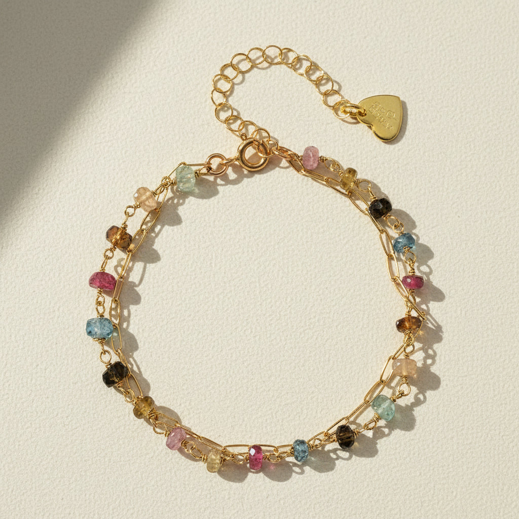 Gold-tone paperclip bracelet with multicolor beads and heart clasp