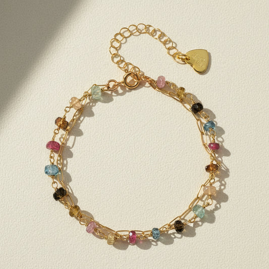 Gold-tone paperclip bracelet with multicolor beads and heart clasp