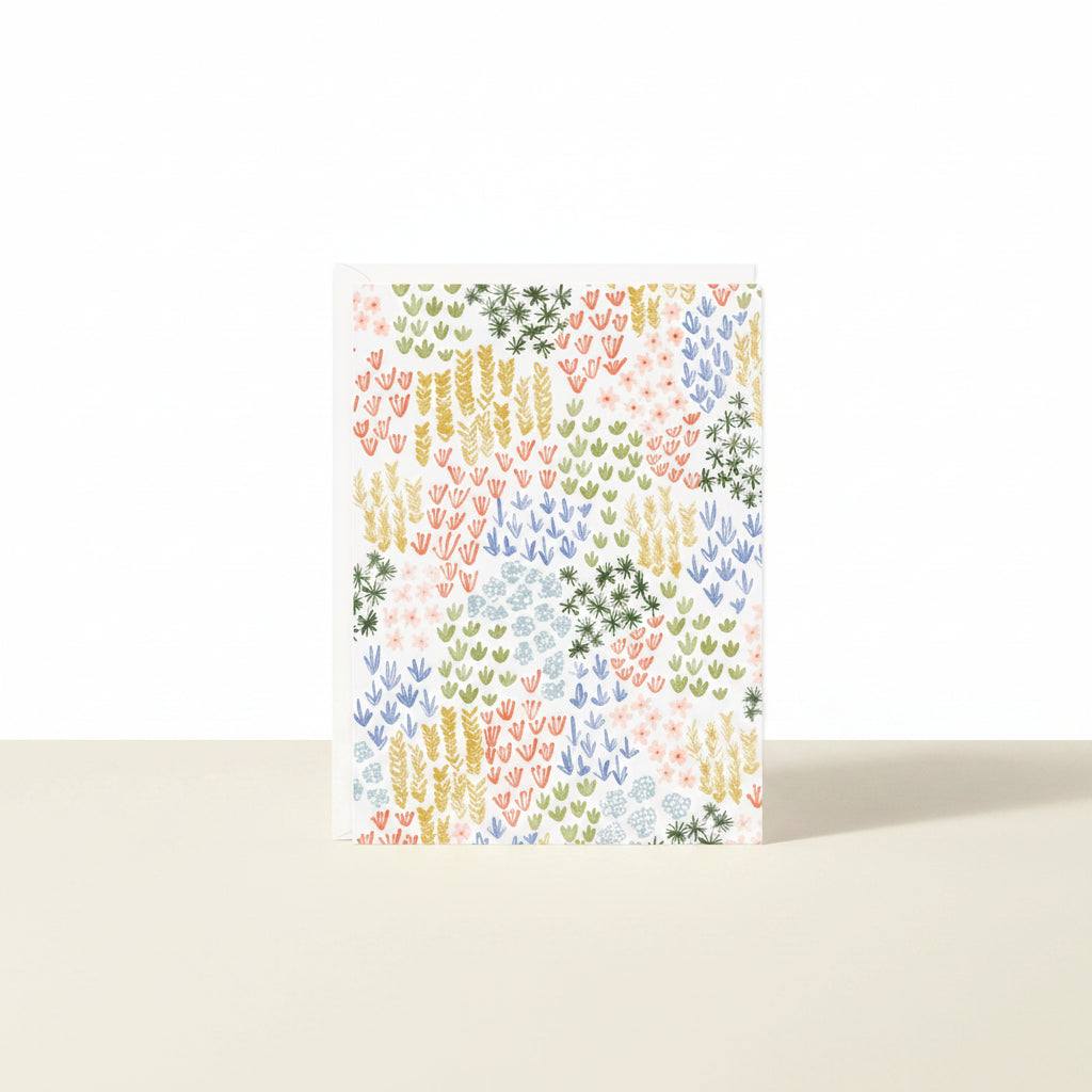 Colorful patterned paper with a geometric design on a white background