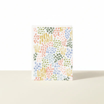 Colorful patterned paper with a geometric design on a white background
