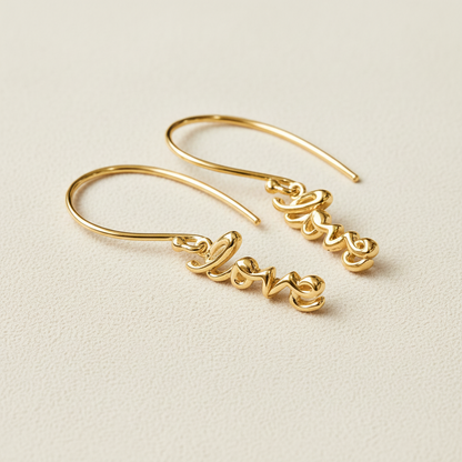 Gold script dangle earrings with hoop hooks and love charm