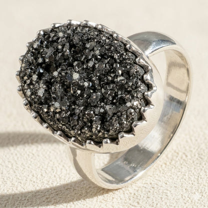 Large oval druzy ring with black glitter stone and silver band