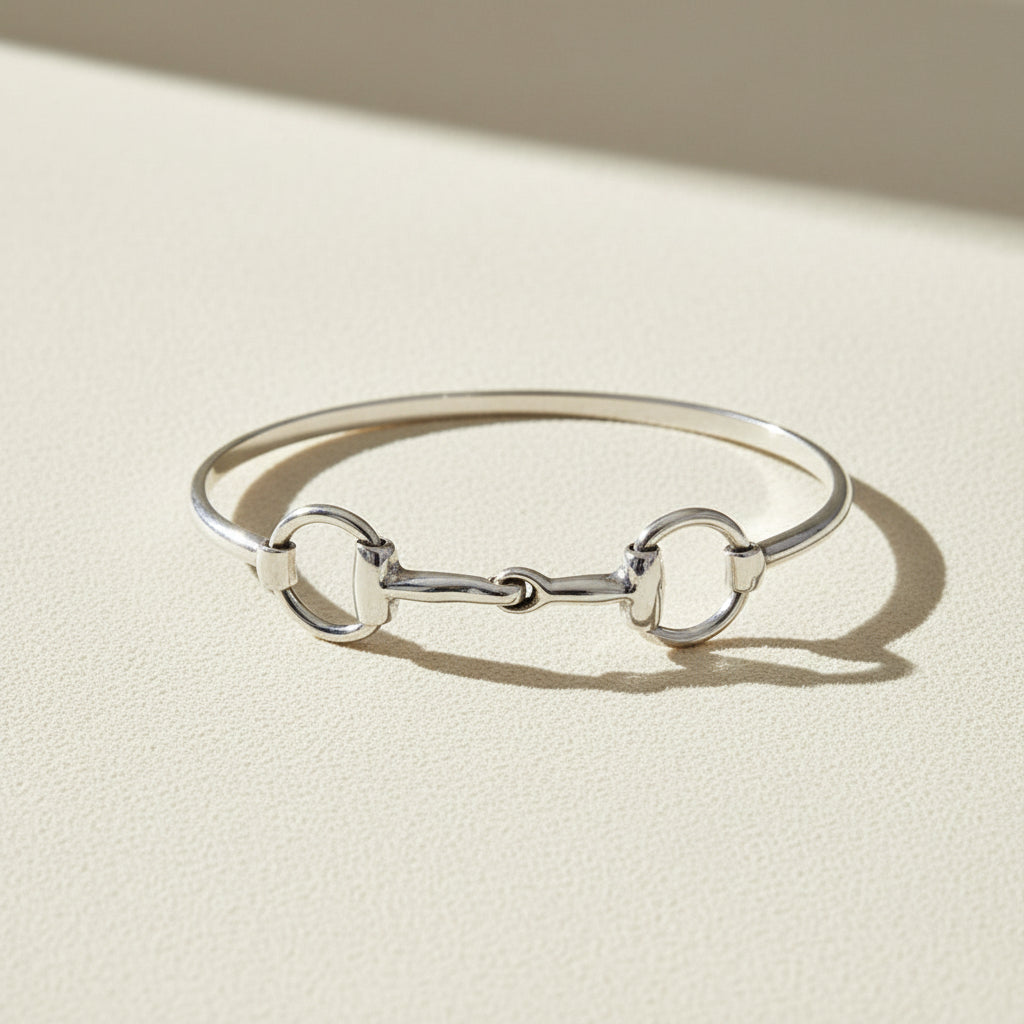 Silver horse-bit bangle bracelet with three link loops
