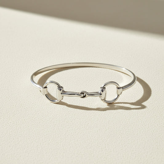 Silver horse-bit bangle bracelet with three link loops