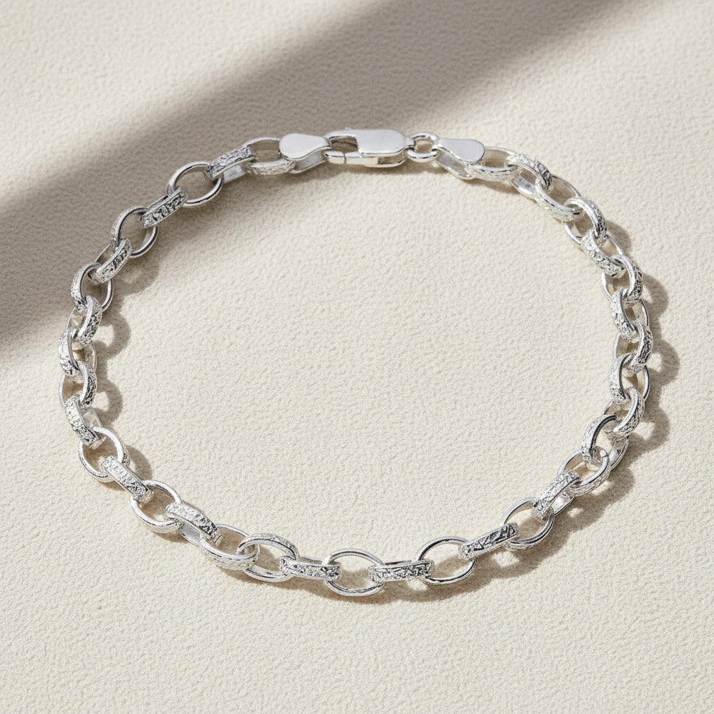 Silver chain bracelet on a white background