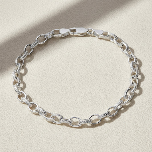 Silver chain bracelet on a white background