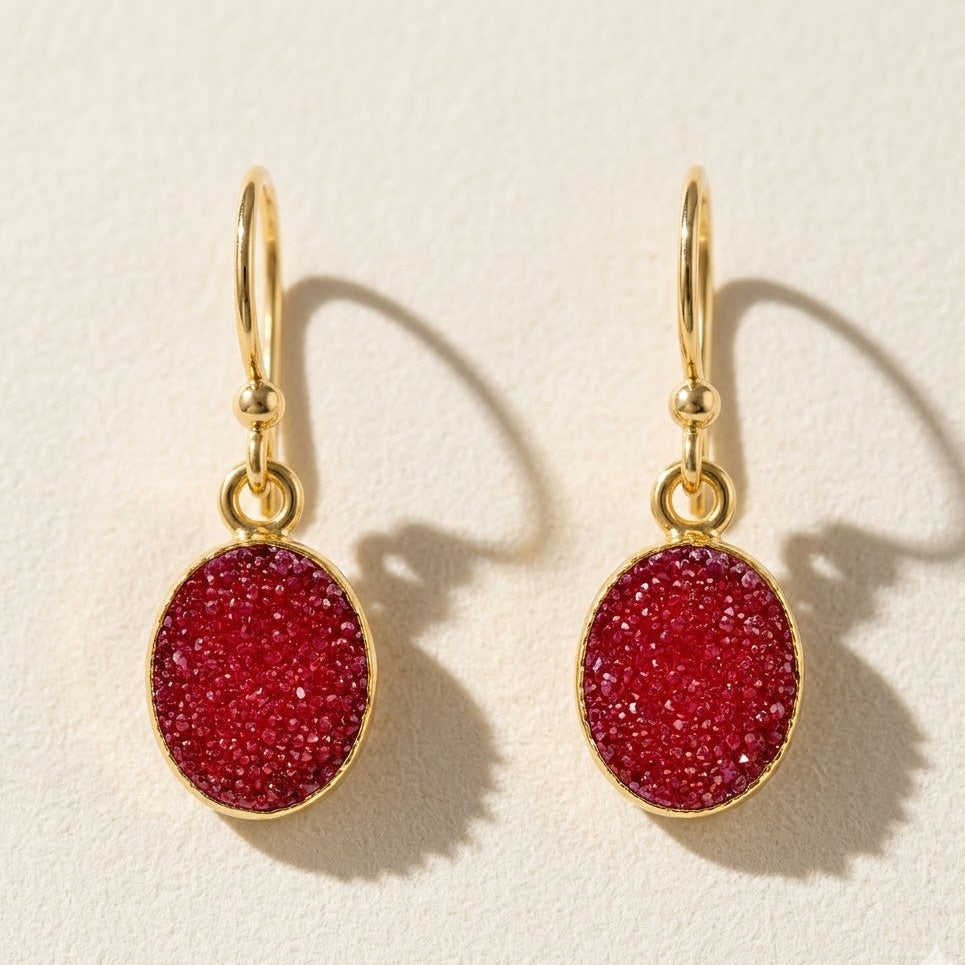 Oval red druzy drop earrings with gold-tone hooks and small round rings