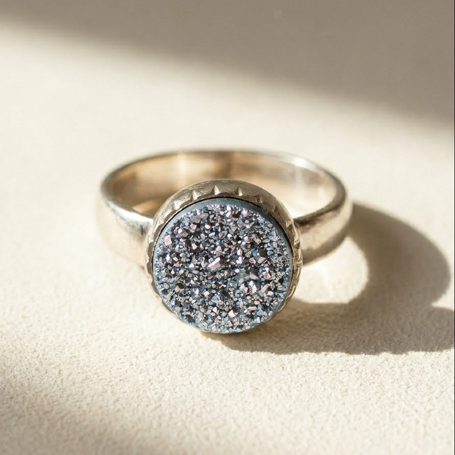 Small round druzy ring with dark gray-blue glitter stone in silver bezel