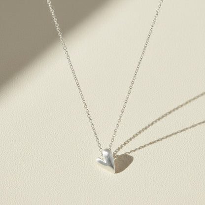 Heart pendant necklace with small polished silver heart charm on chain