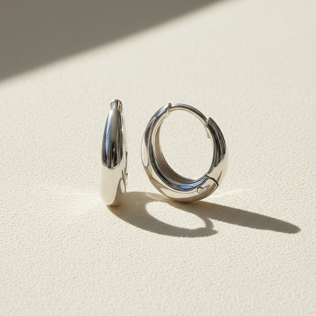 Silver teardrop huggie hoop earrings