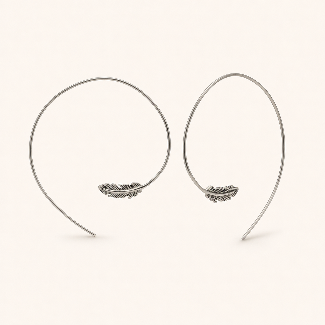 Silver feather pull-through hoop earrings with dangling feather charms