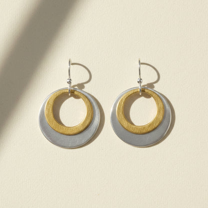Two-tone double circle earrings with gold inner ring and silver outer disc