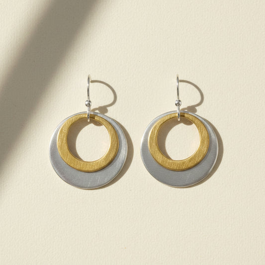 Two-tone double circle earrings with gold inner ring and silver outer disc