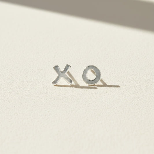 XO stud earrings with X and O metal letters, silver-tone finish