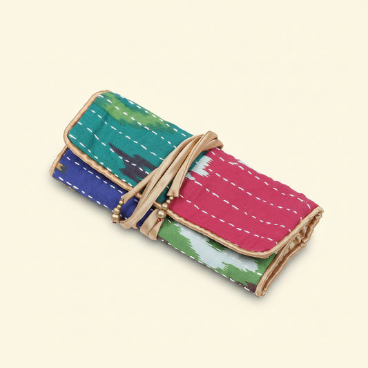 Colorful fabric roll with a beige strap on a white background