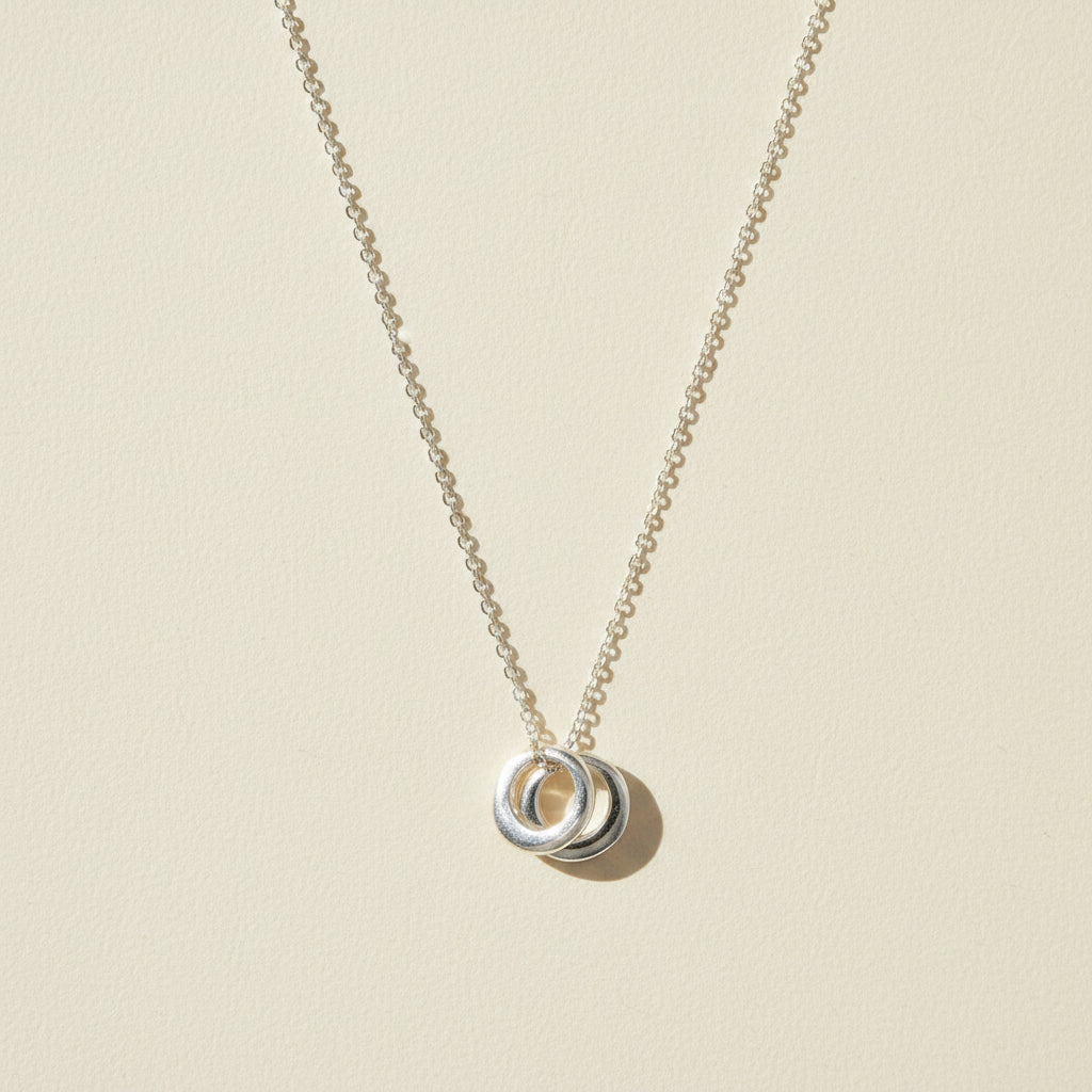 Two-circle pendant necklace with silver-tone linked rings