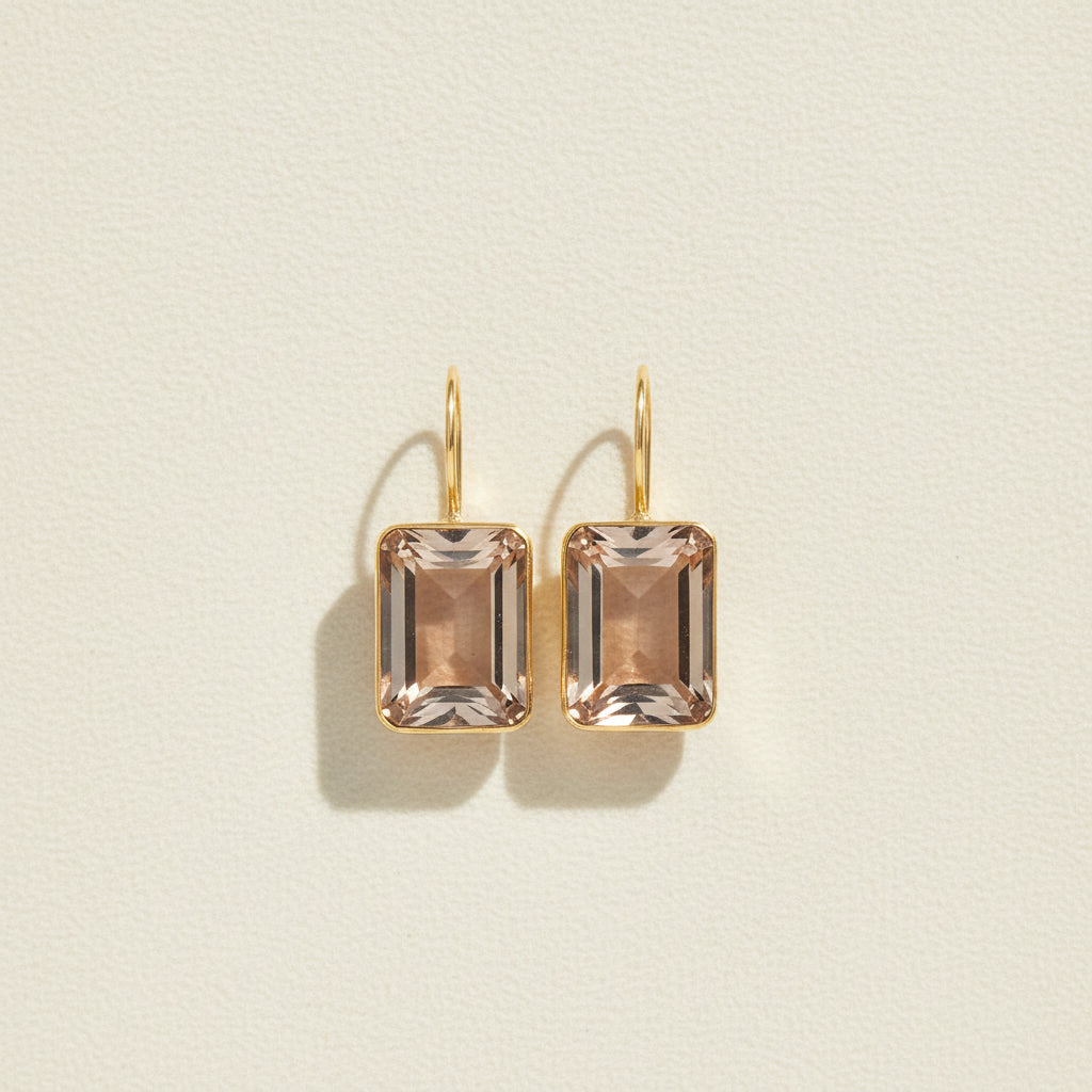 Gold-tone emerald-cut drop earrings with champagne crystal squares, hinged hook tops