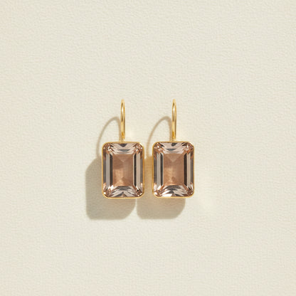 Gold-tone emerald-cut drop earrings with champagne crystal squares, hinged hook tops