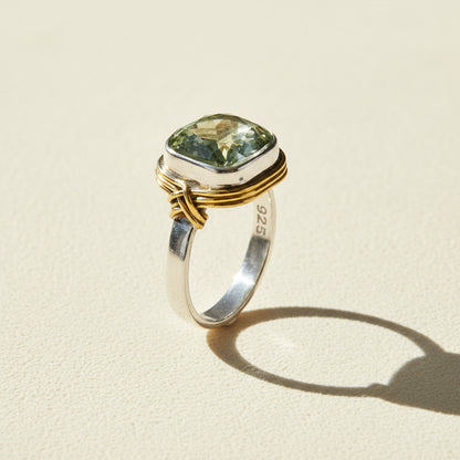 Two-tone ring with rectangular pale green gemstone and inner 925 stamp on band