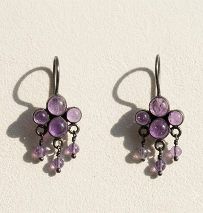 Amethyst cluster dangle earrings with purple round stones and silver-tone hooks