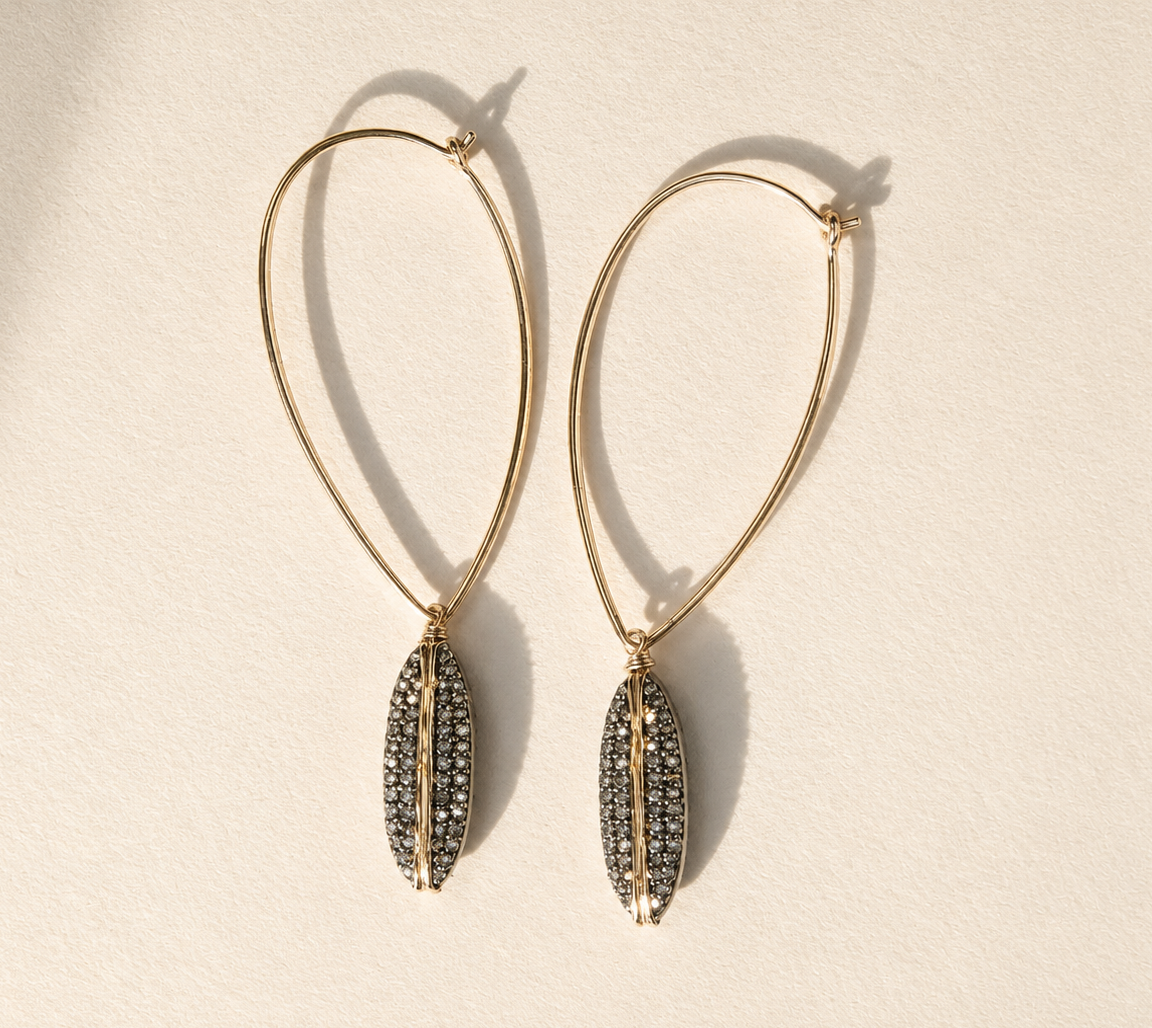 Pave diamond ellipse hoop earrings with gold teardrop drop charms
