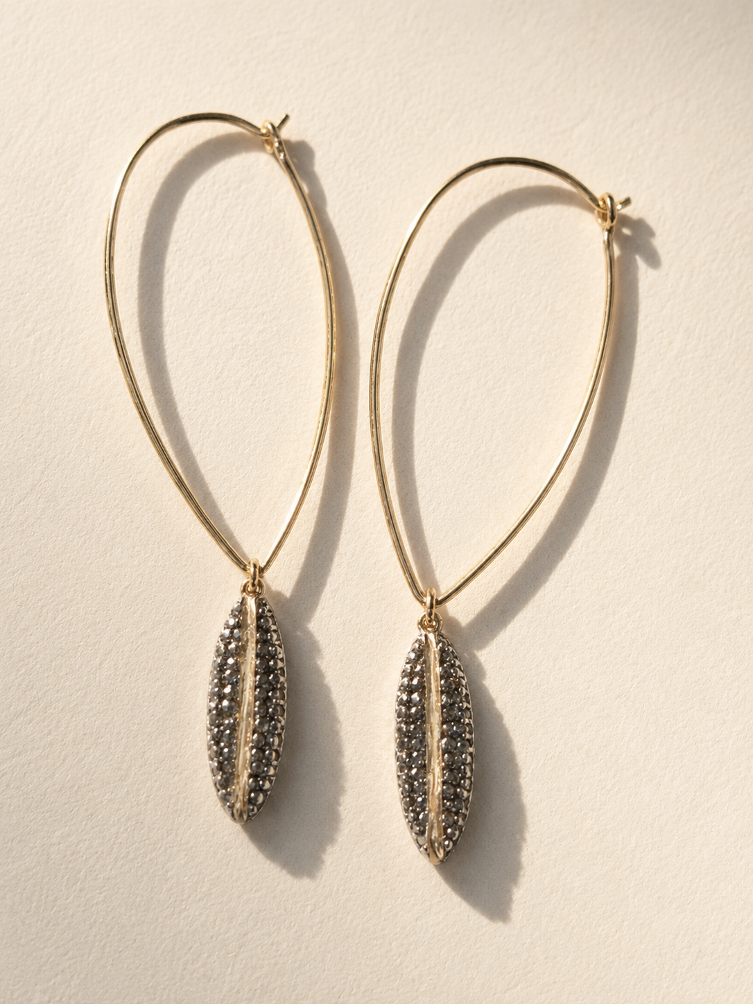 Gold ellipse hoop earrings with pavé diamond drop pendants