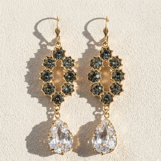 Gold-tone chandelier earrings with dark faceted clusters and teardrop clear crystals
