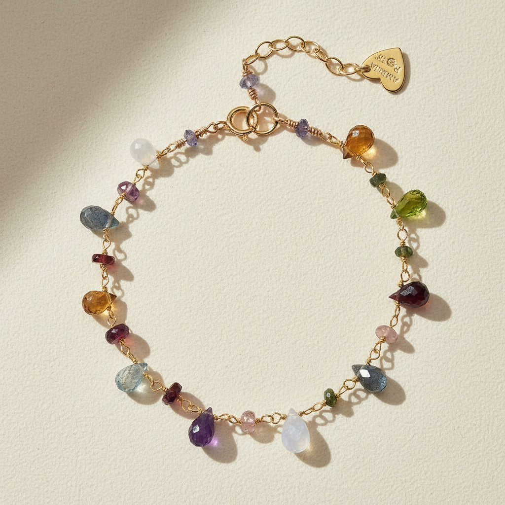 Gold-tone beaded bracelet with multicolor crystal charms and lobster clasp