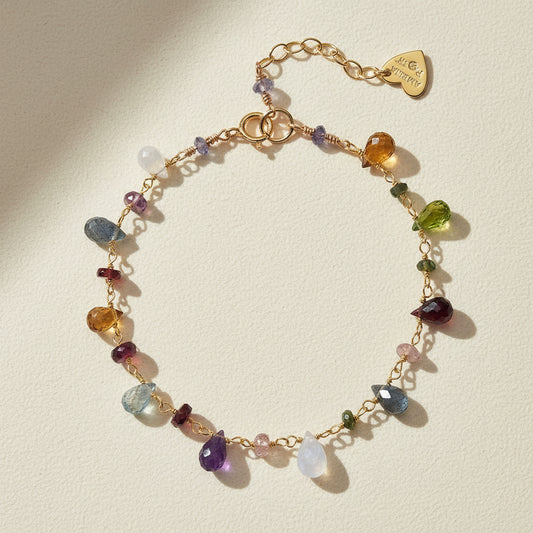 Gold-tone beaded bracelet with multicolor crystal charms and lobster clasp