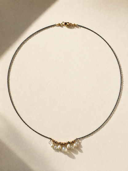 Short chain necklace with white pearl cluster and gold-tone accent beads at center