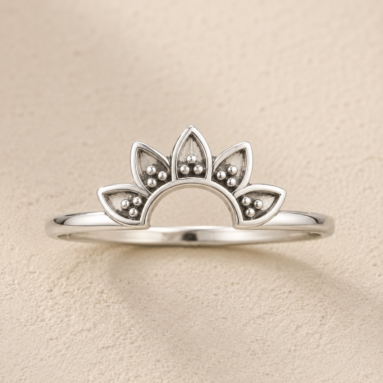 Silver lotus flower ring with small bead-like details along petals