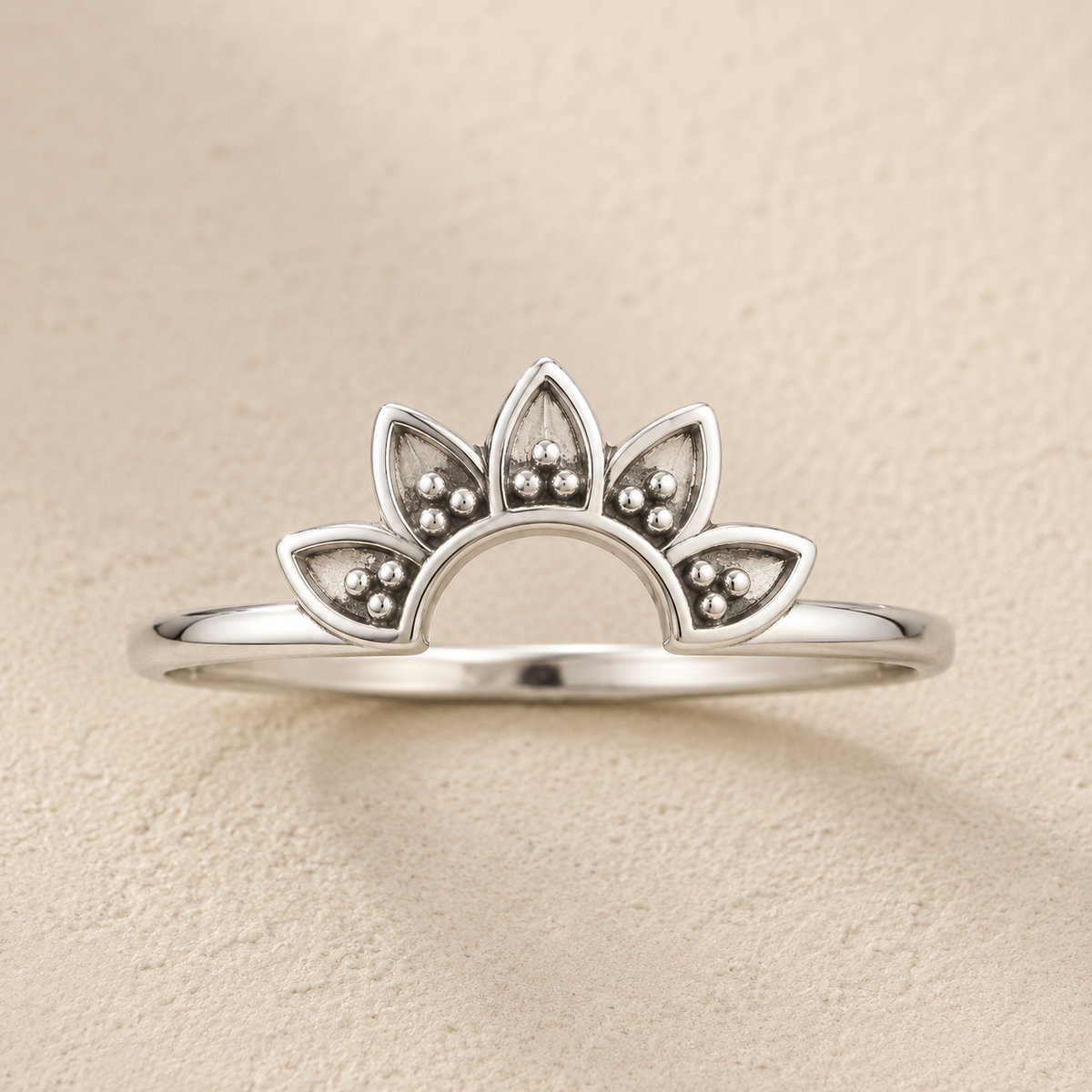 Silver lotus flower ring with small bead-like details along petals