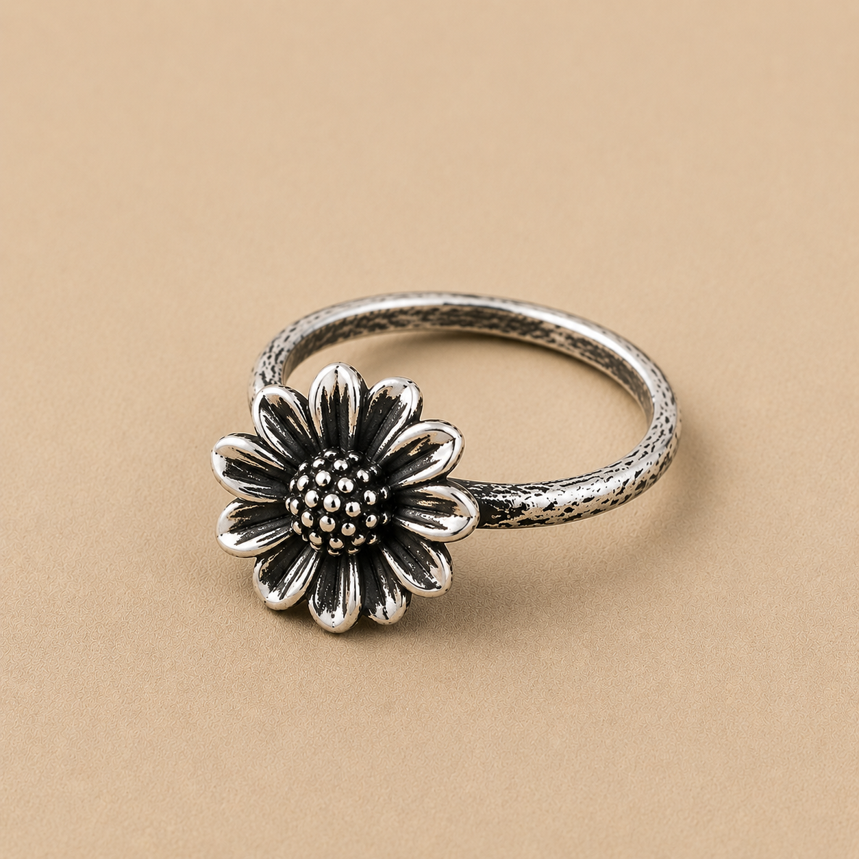 Sterling silver ring with a daisy flower design and bead center
