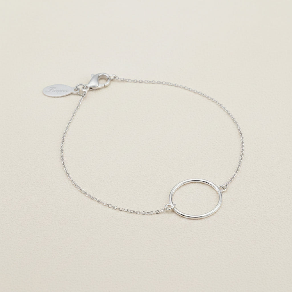 Silver circle charm bracelet with fine chain and small tag clasp