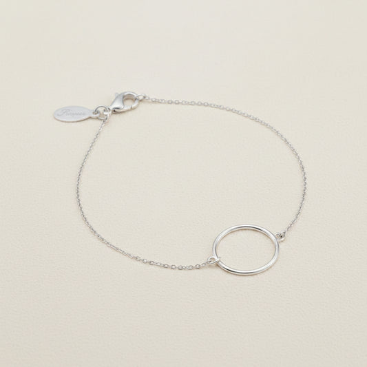 Silver circle charm bracelet with fine chain and small tag clasp