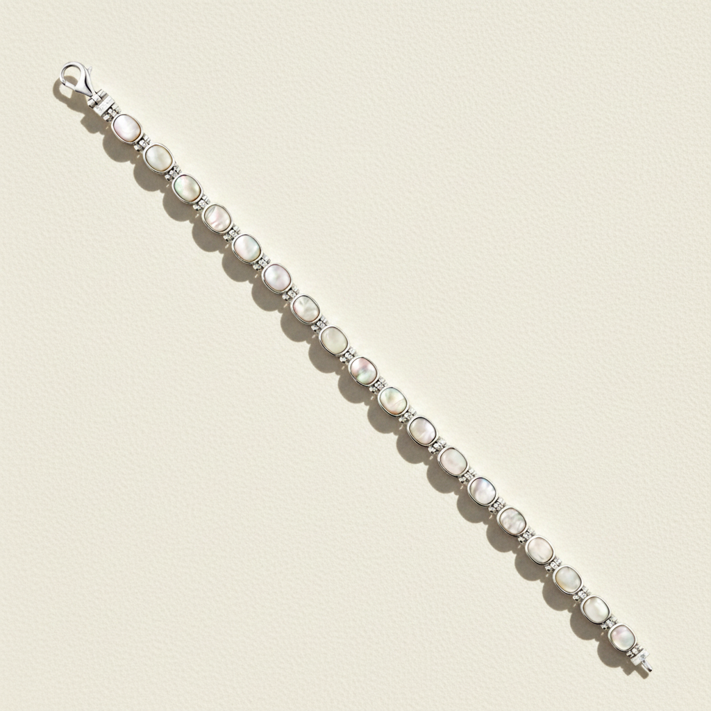 Silver reversible bracelet with white oval cabochons and dark oval accents