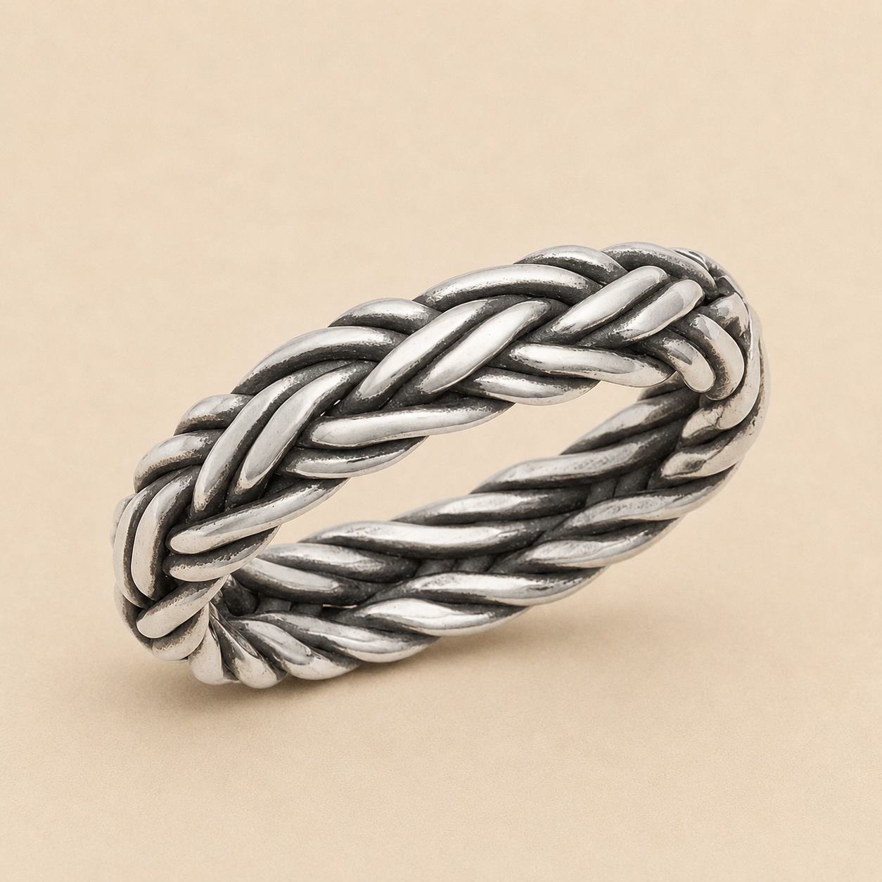 Braided band ring in silver-tone metal with twisted rope braid detail