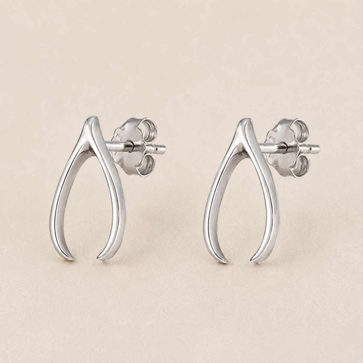 Silver teardrop wishbone stud earrings with butterfly back posts