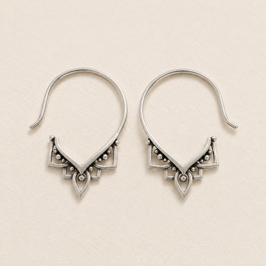 Silver-tone hoop pull-through earrings with ornate triangular beaded detail