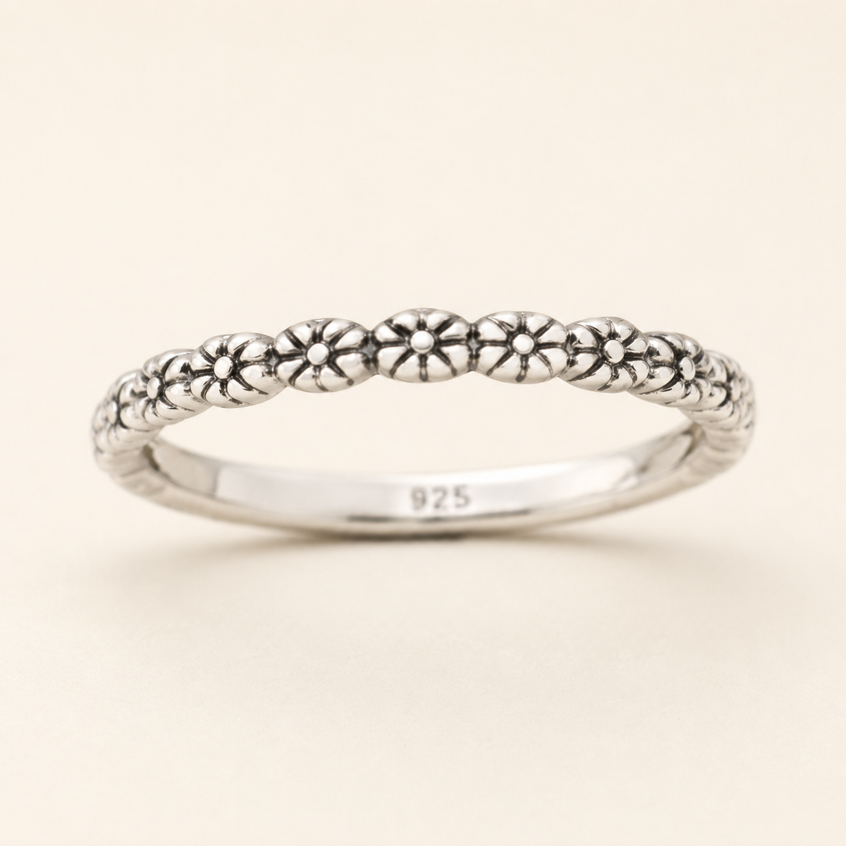 925 sterling silver ring with tiny flower motifs along slim band