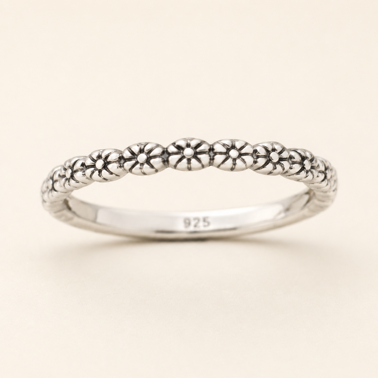 925 sterling silver ring with tiny flower motifs along slim band