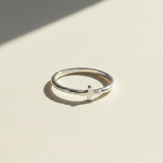 Dainty side cross ring, silver-tone band with small cross charm on the side.