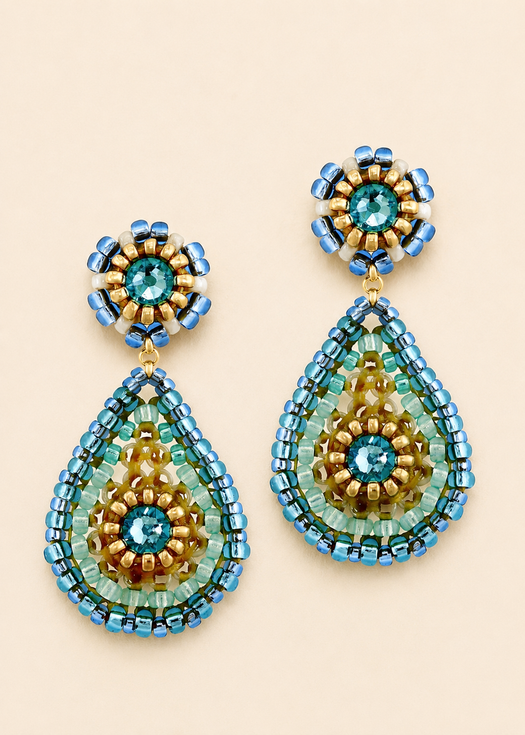 Small beaded teardrop post earrings with blue, gold, and turquoise beadwork and dangling drops
