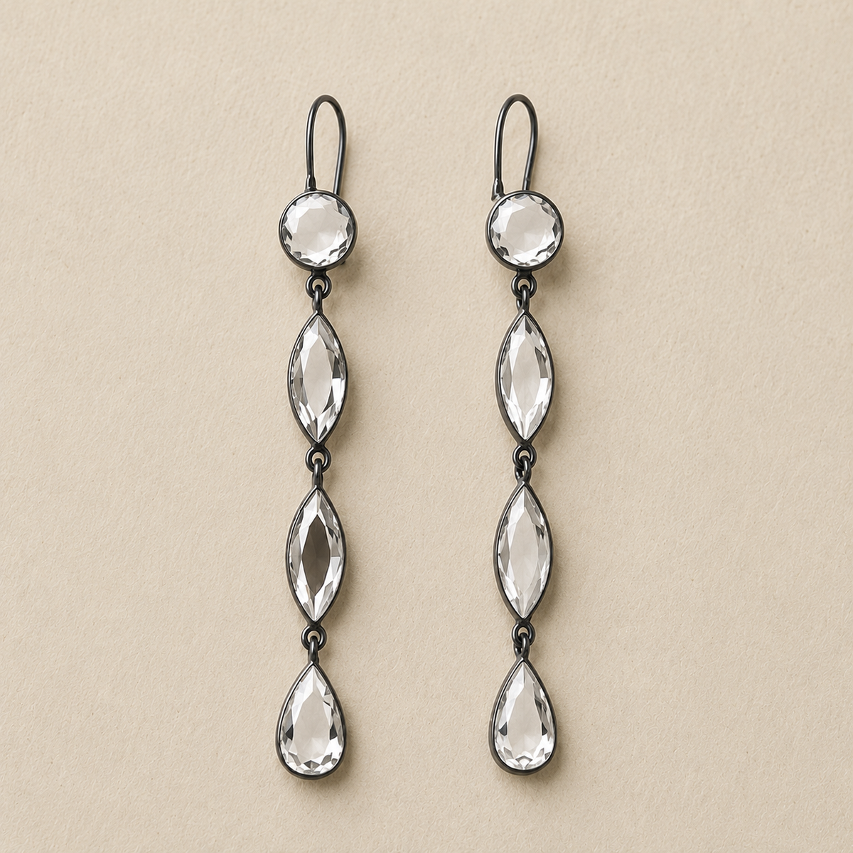 Pair of long mirrored drop earrings with three faceted teardrop charms and silver hooks