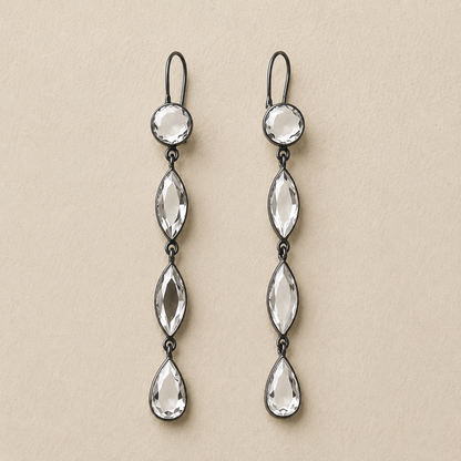 Pair of long mirrored drop earrings with three faceted teardrop charms and silver hooks