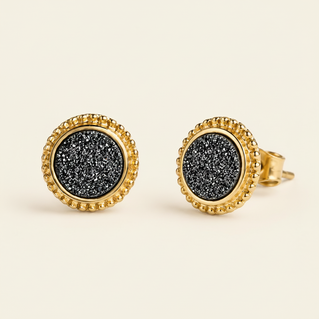 Black druzy round stud earrings with gold-tone bezel and textured center