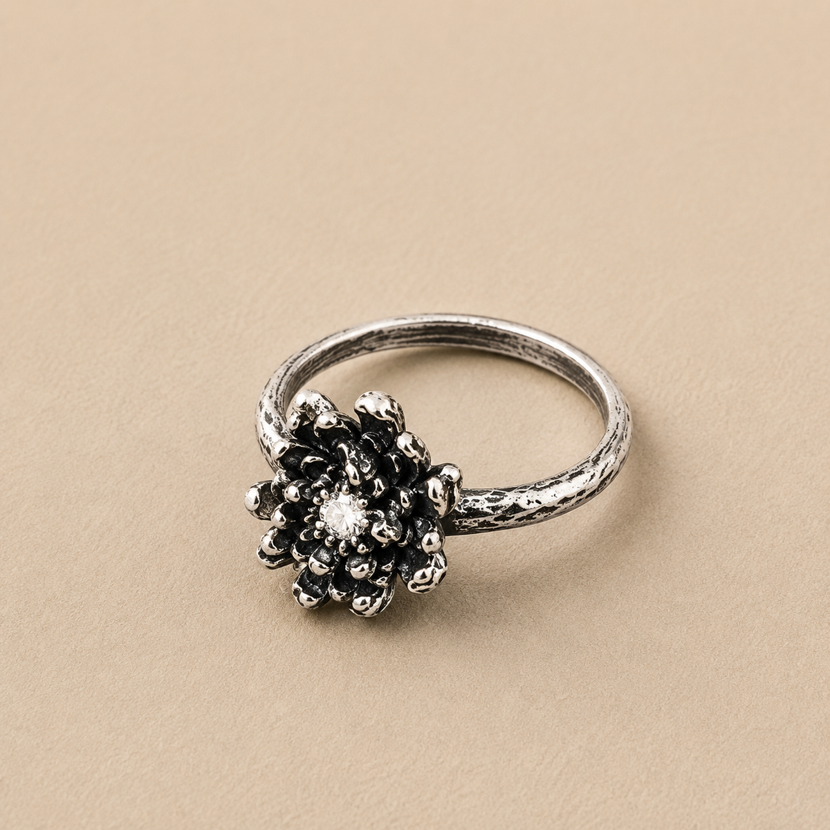 Sterling silver ring with a textured daisy-like flower cluster