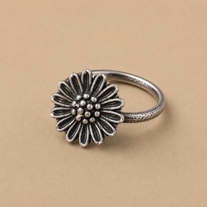 Sterling silver ring with a large daisy blossom and bead-studded center