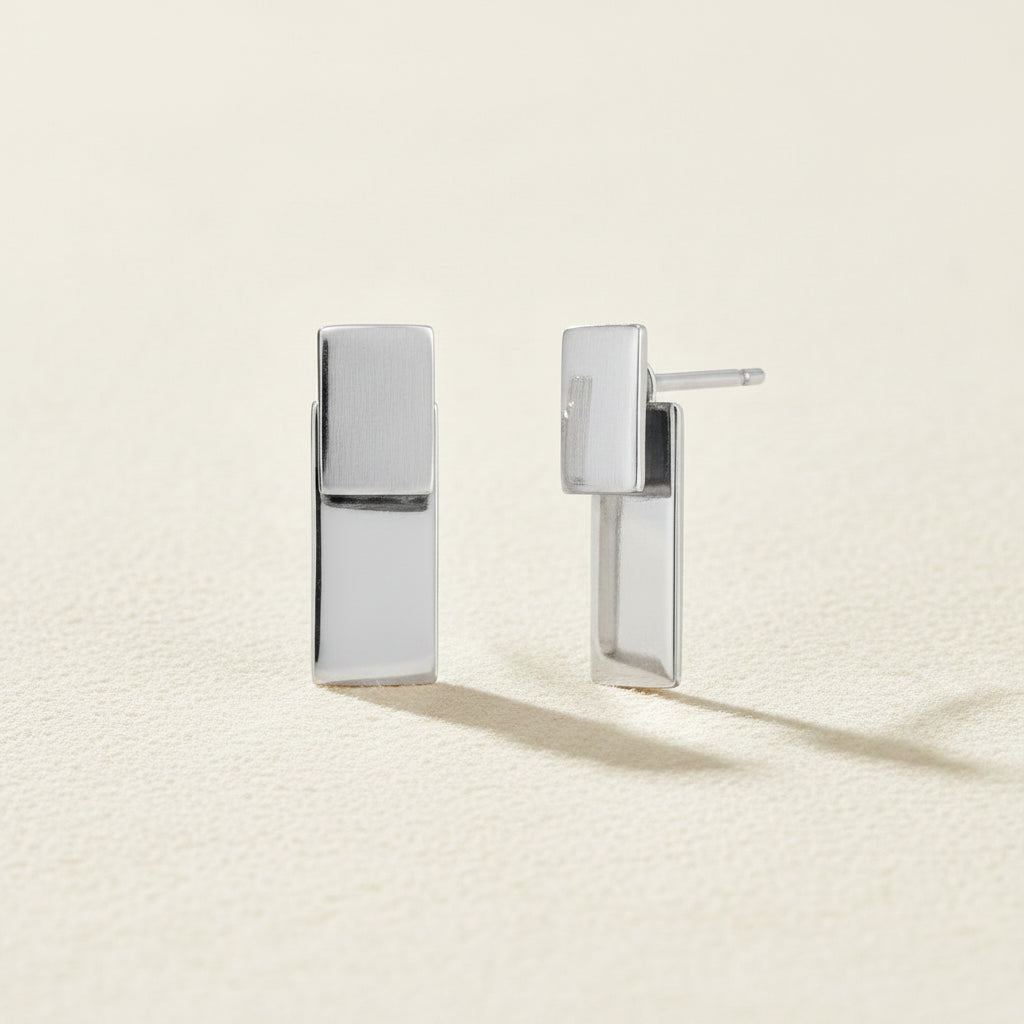 Silver rectangular post earrings with stacked vertical bar design