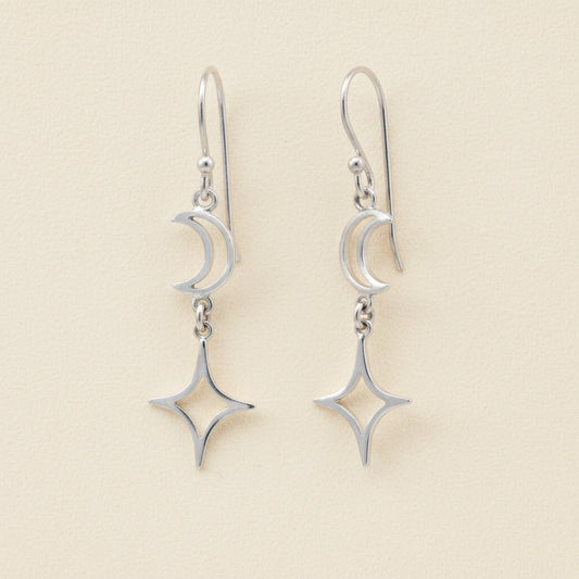 Silver-tone dangle earrings with crescent moon and star charms on linked hooks